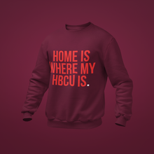 Load image into Gallery viewer, A dark burgundy crewneck sweatshirt with bold red text reading 'HOME IS WHERE MY HBCU IS.' on the front.

